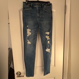 Abercrombie & Fitch Ripped High rise Skinny Jeans in Medium Wash